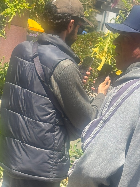 iPhone 17 Pro prototype with redesigned camera island and lower Apple logo spotted in public in protective case.